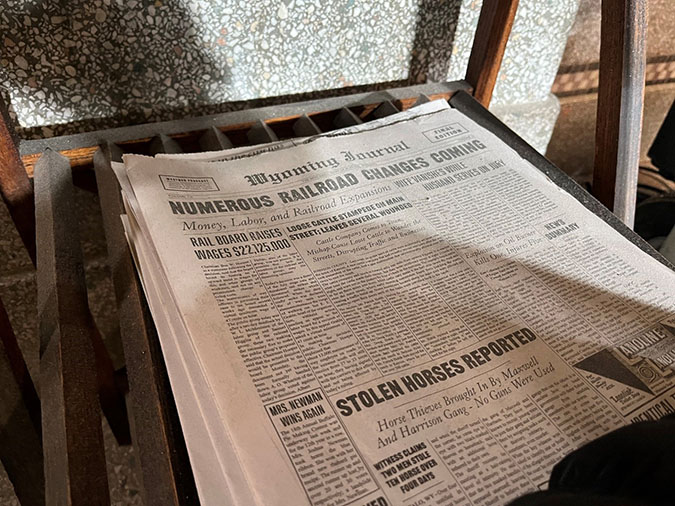 Prop newspapers with news of the times are seen around the interior of the Butte depot. Prop newspapers with news of the times are seen around the interior of the Butte depot.
