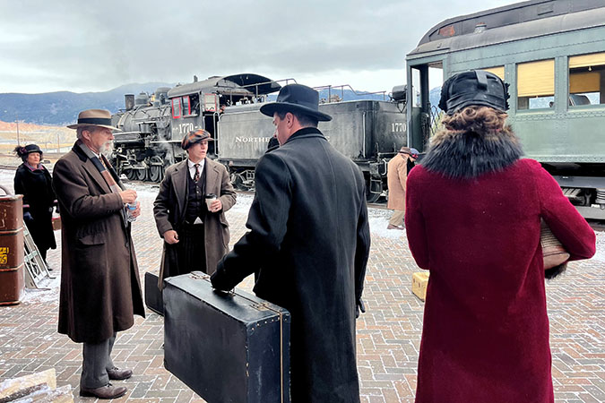 Cast and crew mingle during filming. Far right: Brian Konowal, who plays Clyde, with his body double, Tad Griffith, behind him. Cast and crew mingle during filming. Far right: Brian Konowal, who plays Clyde, with his body double, Tad Griffith, behind him.