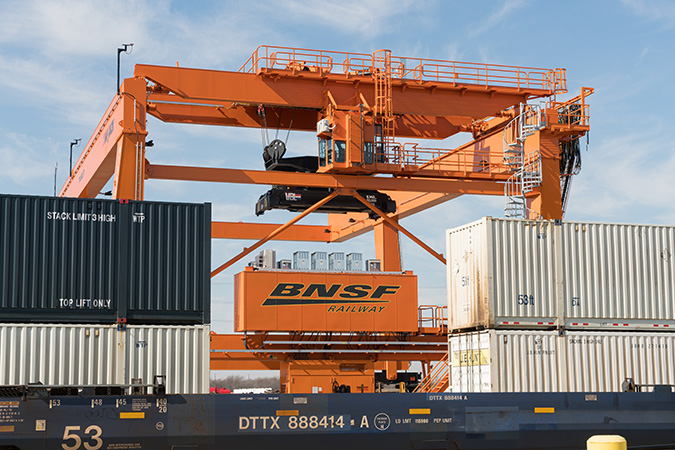 Intermodal crane moving intermodal cars at Alliance Yard in Fort Worth, Texas Intermodal crane moving intermodal cars at Alliance Yard in Fort Worth, Texas