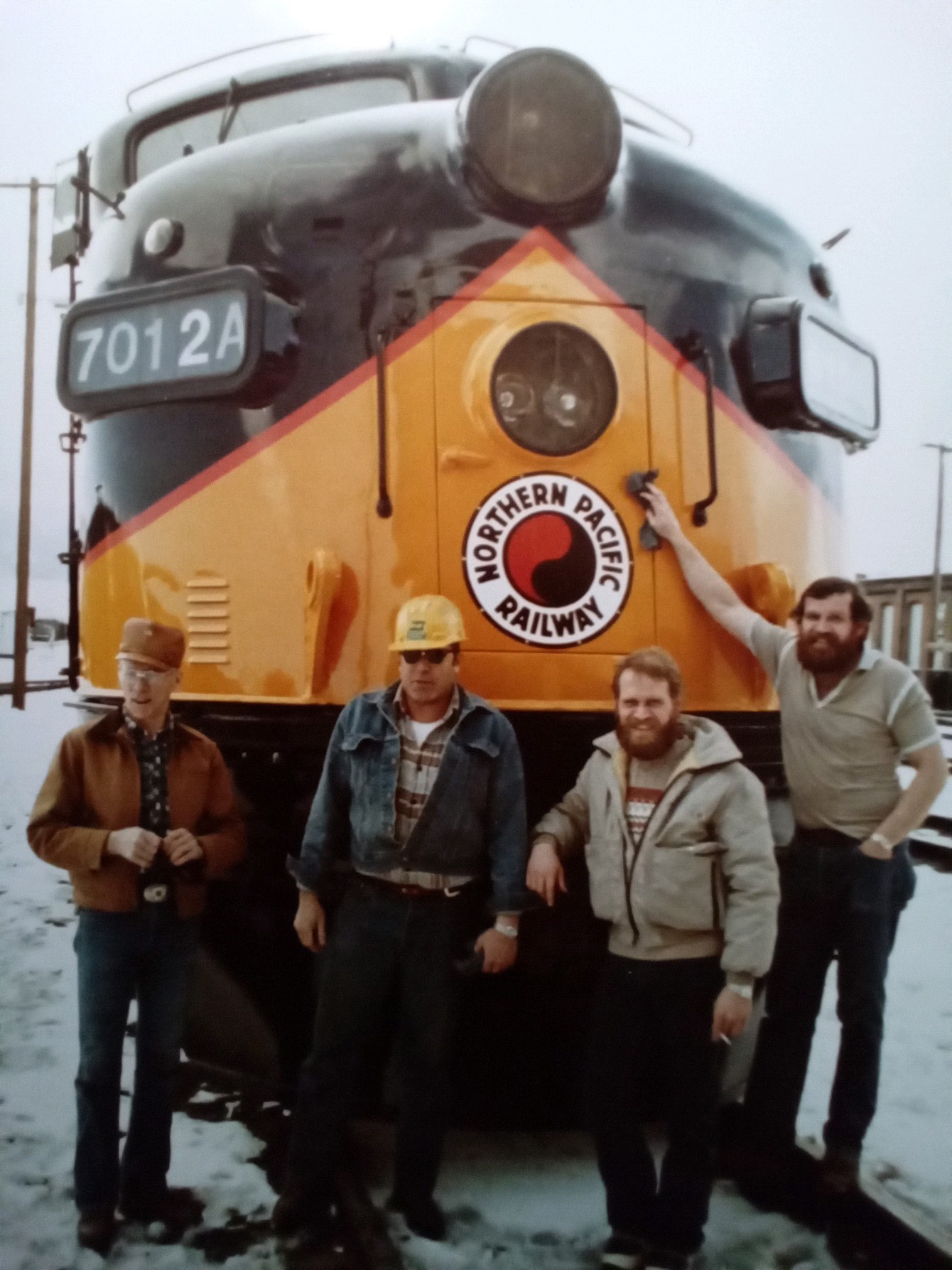 Bill Hampson, left, standing in front of a Northern Pacific Railway locomotive with three colleagues Bill Hampson, left, standing in front of a Northern Pacific Railway locomotive with three colleagues