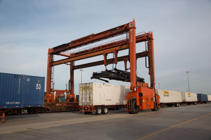 A BNSF intermodal crane operates at Alliance Intermodal Facility. A BNSF intermodal crane operates at Alliance Intermodal Facility.