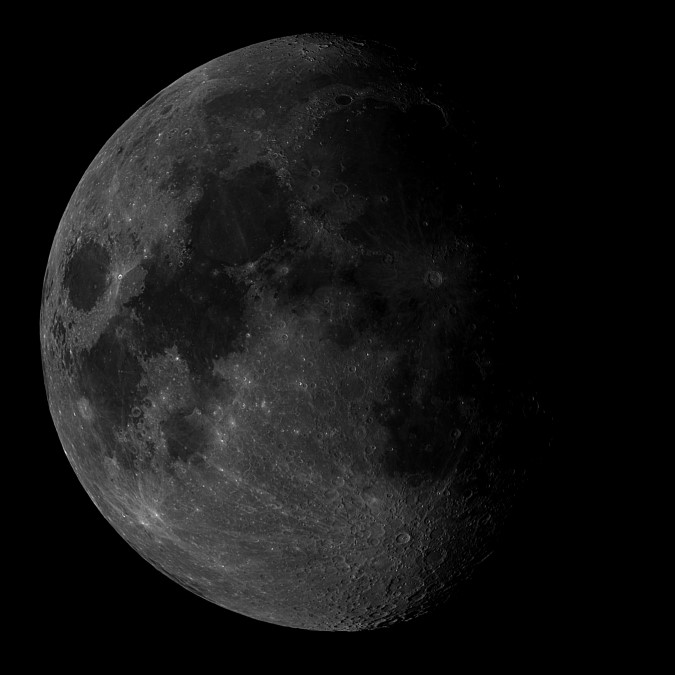 The dark areas in this photo are lava flows that occurred when the moon was struck by asteroids and comets after it was fully formed, but not yet fully solid. The dark areas in this photo are lava flows that occurred when the moon was struck by asteroids and comets after it was fully formed, but not yet fully solid.