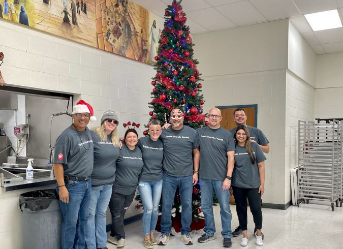 Members of the Topeka Diversity Council participate in the Topeka Rescue Mission Christmas event. Members of the Topeka Diversity Council participate in the Topeka Rescue Mission Christmas event.