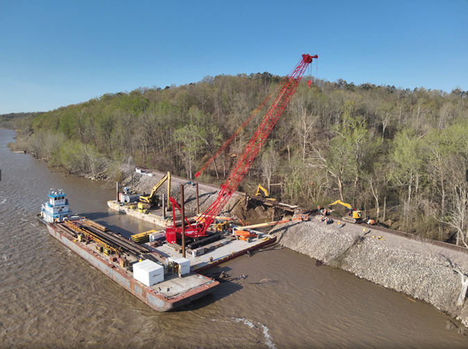 Barges are used to bring heavy equipment to the construction site. Barges are used to bring heavy equipment to the construction site.
