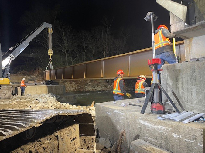 Crews install a bridge span at 3:30 a.m. on April 9. Crews install a bridge span at 3:30 a.m. on April 9.