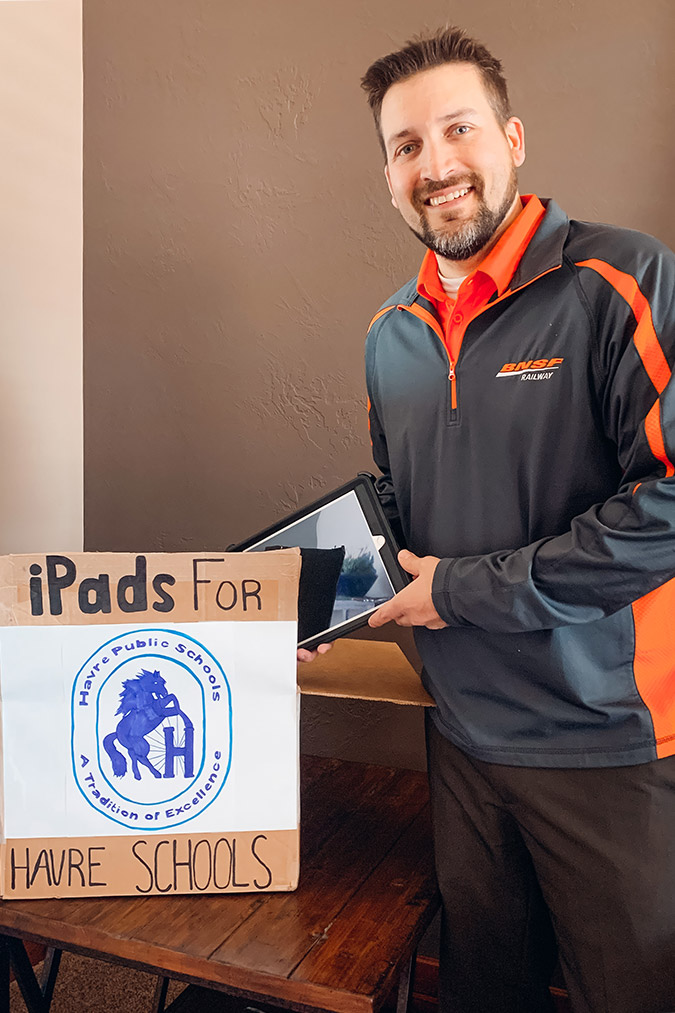 BNSF Havre, Mont., Superintendent Field Ops Shawn Ball boxes iPads for donation to area students. BNSF Havre, Mont., Superintendent Field Ops Shawn Ball boxes iPads for donation to area students.