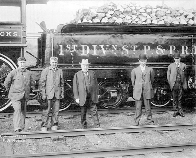 Hill (center) in front of his first locomotive, the W.M. Crooks. Hill (center) in front of his first locomotive, the W.M. Crooks.
