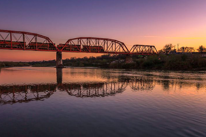 BNSF locomotives operate over the Rio Grande between Eagle Pass, Texas, and Piedras Negras, Mexico. BNSF locomotives operate over the Rio Grande between Eagle Pass, Texas, and Piedras Negras, Mexico.