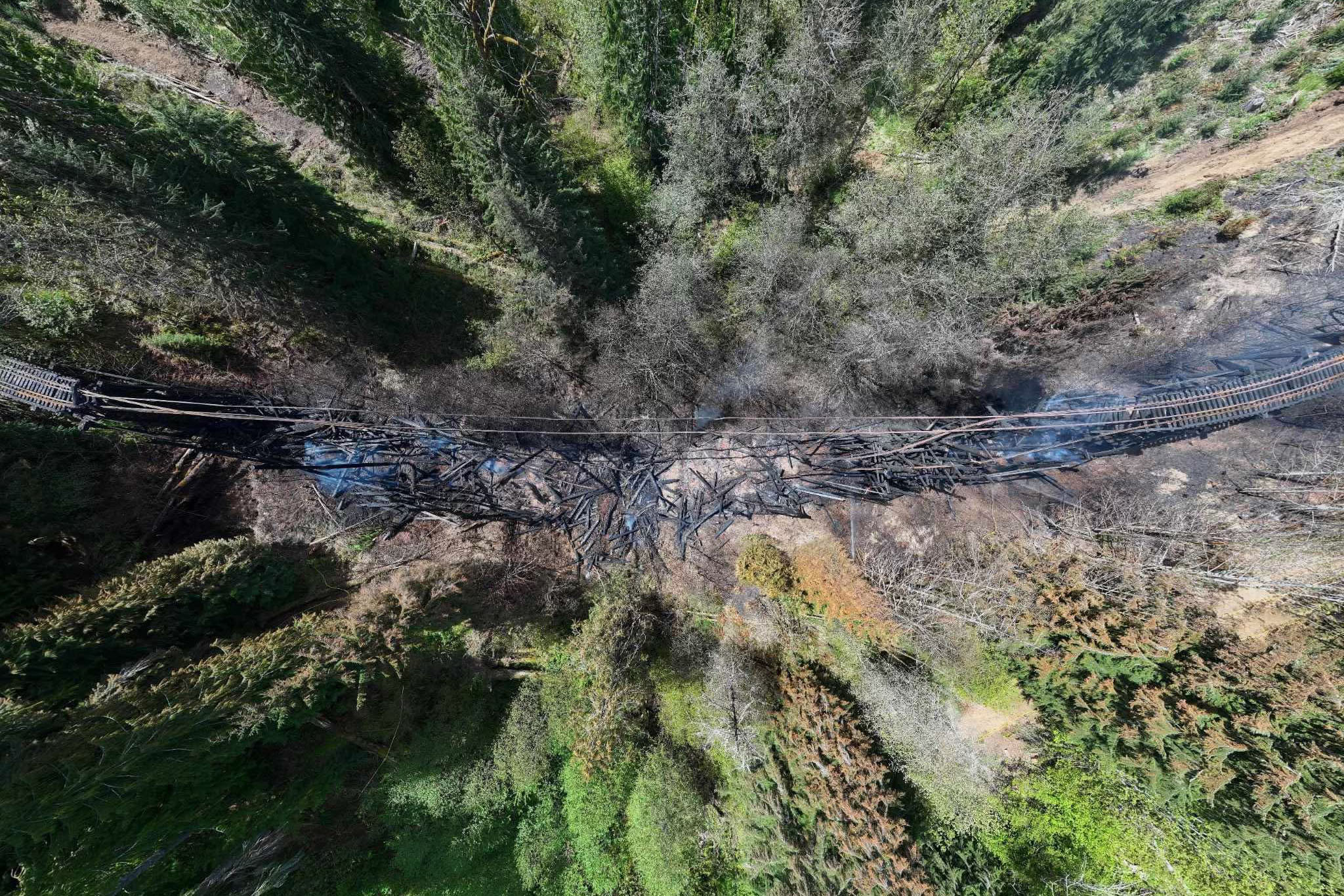 An aerial view of the burning bridge. An aerial view of the burning bridge.