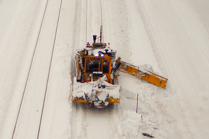 A Mini Dozer sweeping lighter snow off the tracks near Essex, Montana. A Mini Dozer sweeping lighter snow off the tracks near Essex, Montana.