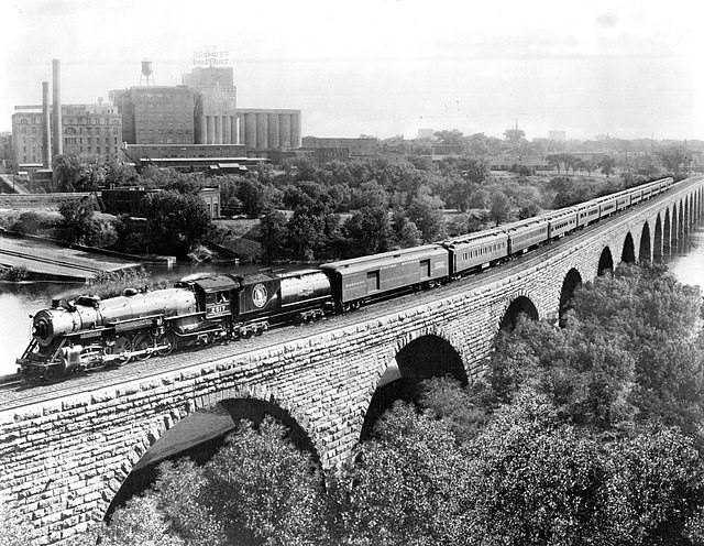 Great Northern’s Empire Builder on the Stone Arch Bridge, part of the ten-mile stretch between Minneapolis and St. Paul Great Northern’s Empire Builder on the Stone Arch Bridge, part of the ten-mile stretch between Minneapolis and St. Paul