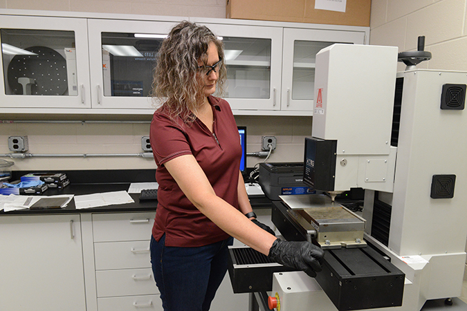 Engineer II Alicia Lollar is performing hardness measurements on a rail and electric flash butt weld sample. A slice was cut out and prepped so hardness readings could be taken across the sample. Engineer II Alicia Lollar is performing hardness measurements on a rail and electric flash butt weld sample. A slice was cut out and prepped so hardness readings could be taken across the sample.