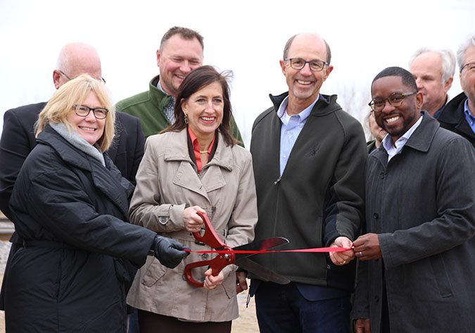 Officials attend the ribbon-cutting ceremony for the bypass project. Front row from left to right, U.S. Rep. Michelle Fischback, Minnesota Department of Transportation Commissioner Nancy Daubenberger, Kandiyohi County Public Works Director Mel Odens, and BNSF General Director Public Investment French Thompson. Officials attend the ribbon-cutting ceremony for the bypass project. Front row from left to right, U.S. Rep. Michelle Fischback, Minnesota Department of Transportation Commissioner Nancy Daubenberger, Kandiyohi County Public Works Director Mel Odens, and BNSF General Director Public Investment French Thompson.